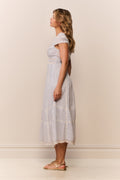 Light blue midi dress from side view with V-neck and tiered embroidered panels