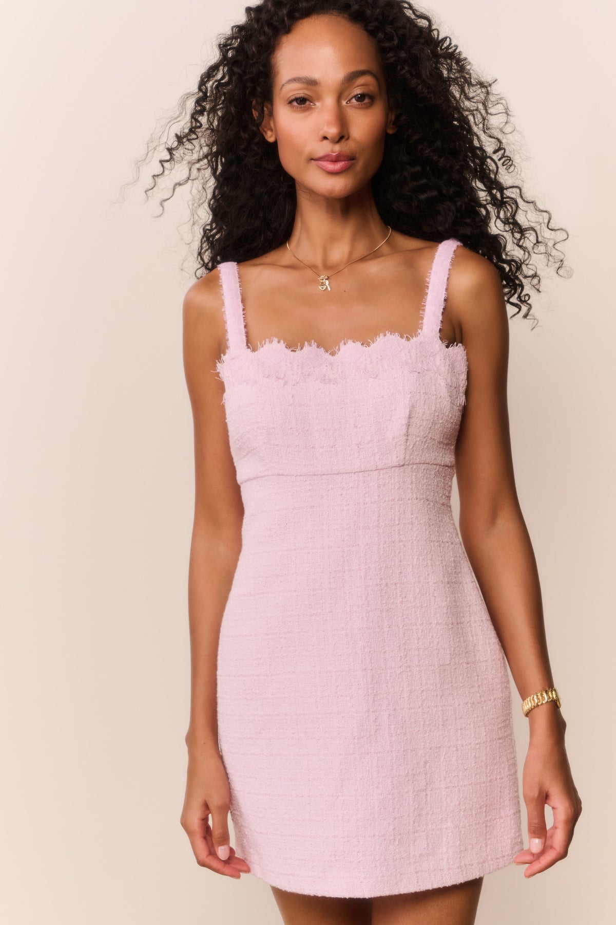 Blush lace-trim tweed mini dress with scalloped neckline and spaghetti straps.