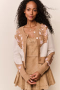 Tan suede eyelet mini dress close-up with scalloped straps and star embroidery