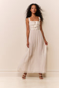Cream sheer maxi dress with bow bodice and lace-trimmed hem