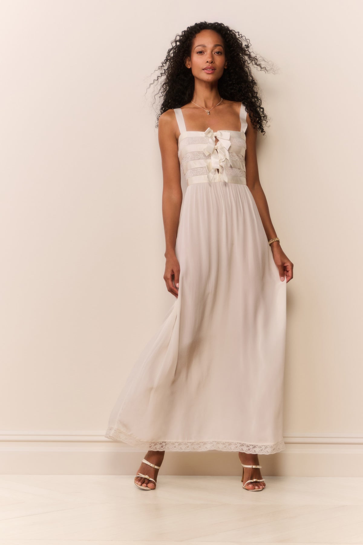 Cream sheer maxi dress with bow bodice and lace-trimmed hem