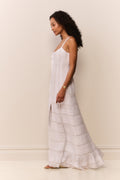 White cotton Victorian maxi dress side view with lace paneling and tiered ruffle hem