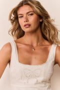Ivory eyelet mini dress bodice with floral cutwork and scalloped square neckline