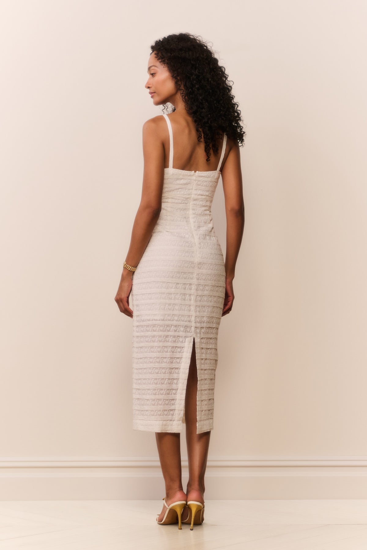 White lace stripe midi dress with spaghetti straps and front slit, side view