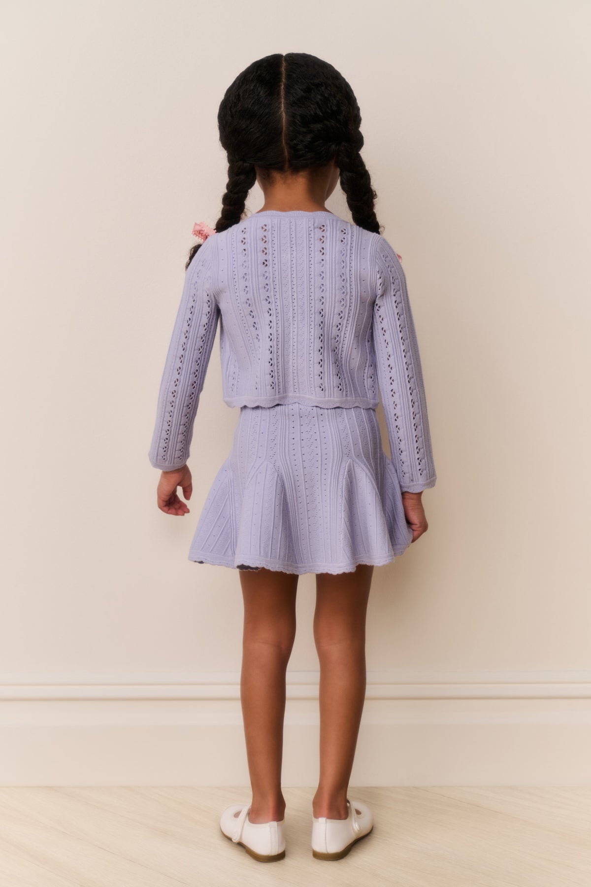 Girls lilac pointelle knit cardigan, back view with lace-like stitch detailing
