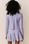 Lavender pointelle knit cardigan with long sleeves, open front, scalloped hem detail.