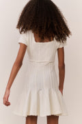 Tween pointelle stretch dress in white, back view with flared skirt