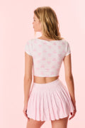 Pink printed active skort, back view with pleated skirt volume