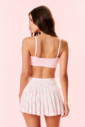 Pink printed active skort with pleated skirt and elastic waistband, back view