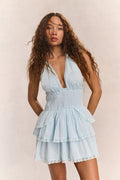 Light blue halter mini dress with deep V neckline, tiered ruffles, lace trim