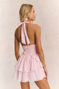 Pink halter mini dress with open back and tied shoulder straps