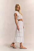 White tiered midi skirt with gathered tiers and embroidered vertical panel details
