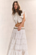 White tiered midi skirt with tiered ruffles and textured stitched panels