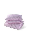 Pink floral duvet cover set with matching shams, folded and stacked