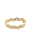 Gold-tone stretch bracelet with white heart-shaped stones