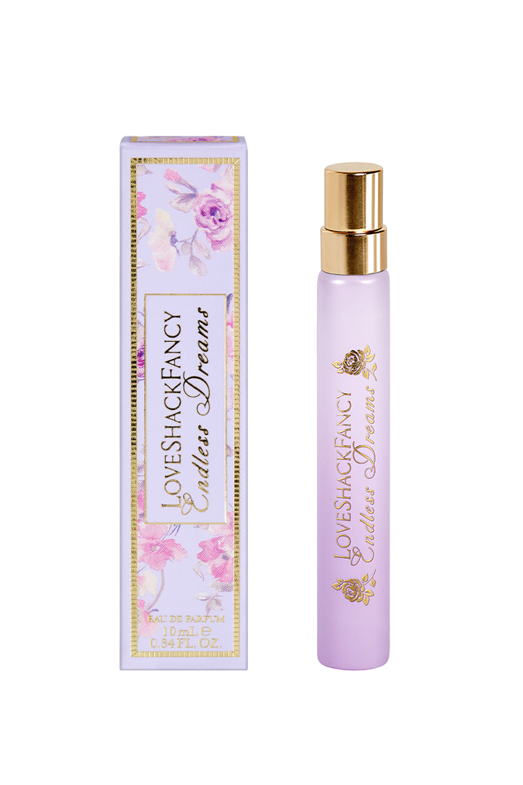 LoveShackFancy purple eau de parfum travel spray bottle with matching box and gold cap