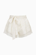 Ivory silk lace shorts with ruffled tiers and tied drawstring waist