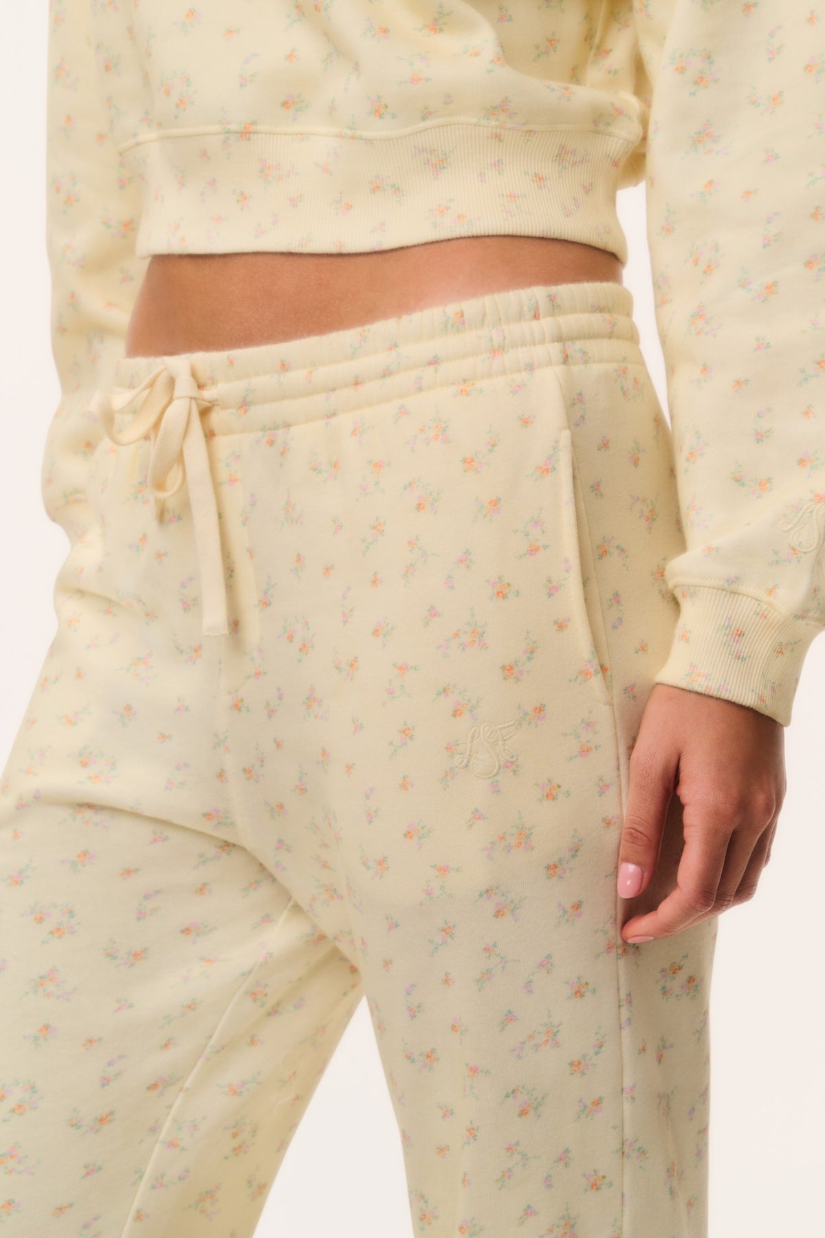 Cream ditsy floral sweatpants close-up of elastic waistband and tied drawstring