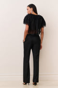 Black wide-leg wool-blend pants with center crease, back view.