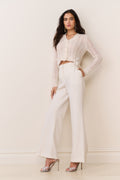 Cream wide-leg trousers with wide cuff hem and tailored waistband