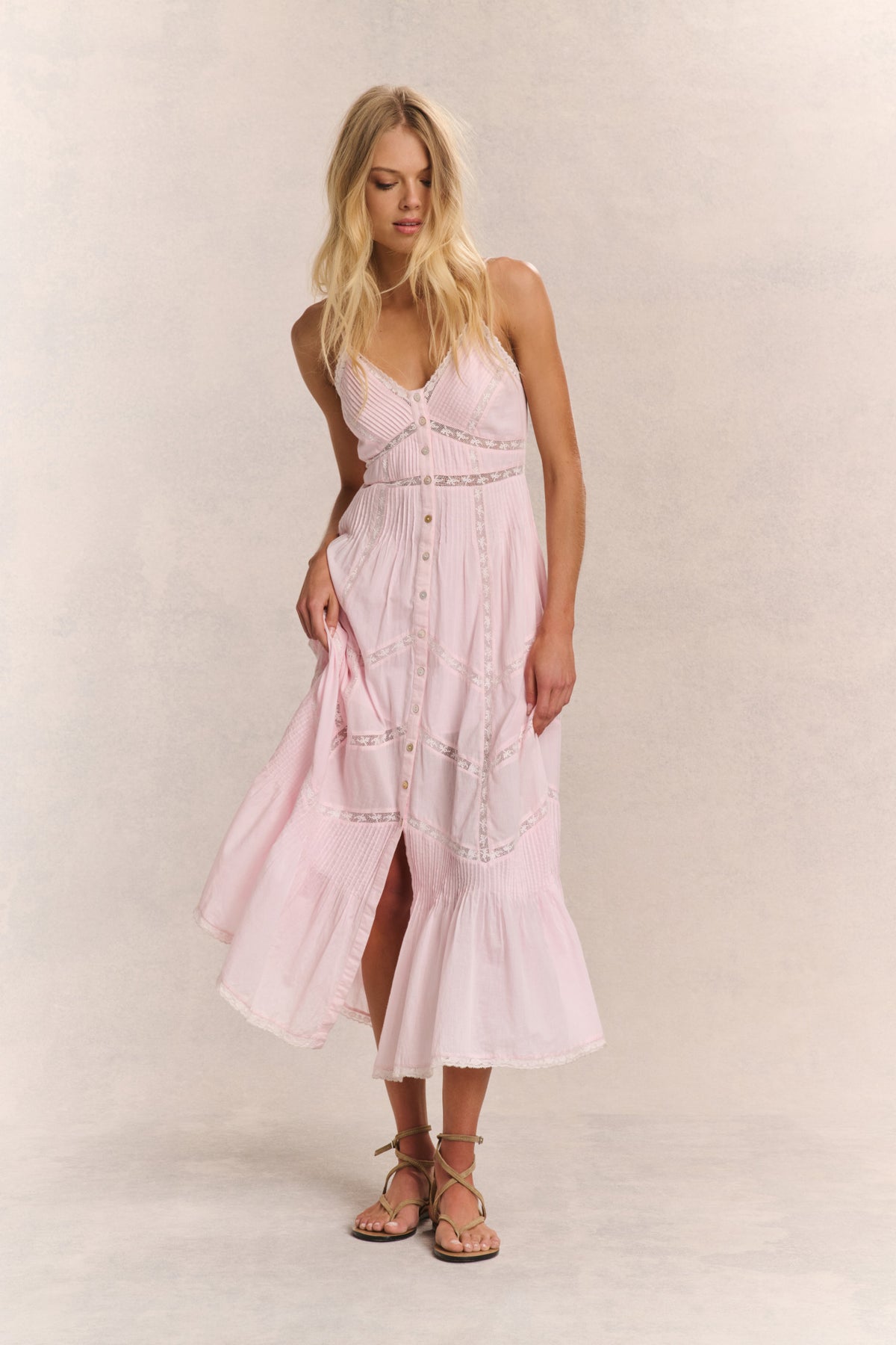 Pink cotton midi dress with spaghetti straps, button front, and tiered patchwork panels