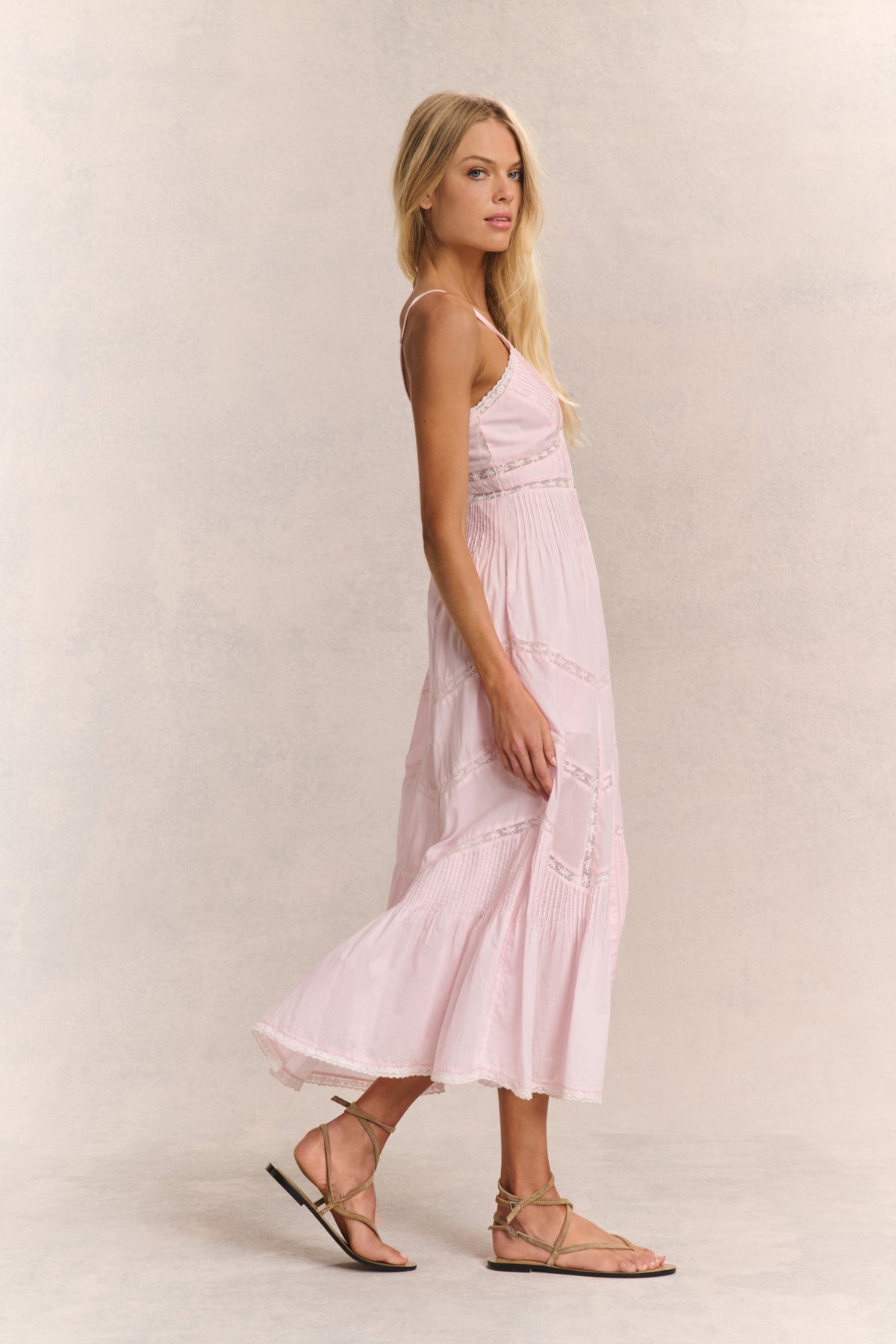 Pink midi cotton dress with spaghetti straps, V-neck, and tiered skirt detail