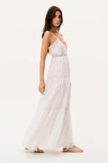 Optic white lace maxi dress with spaghetti straps, layered ruffles, side view