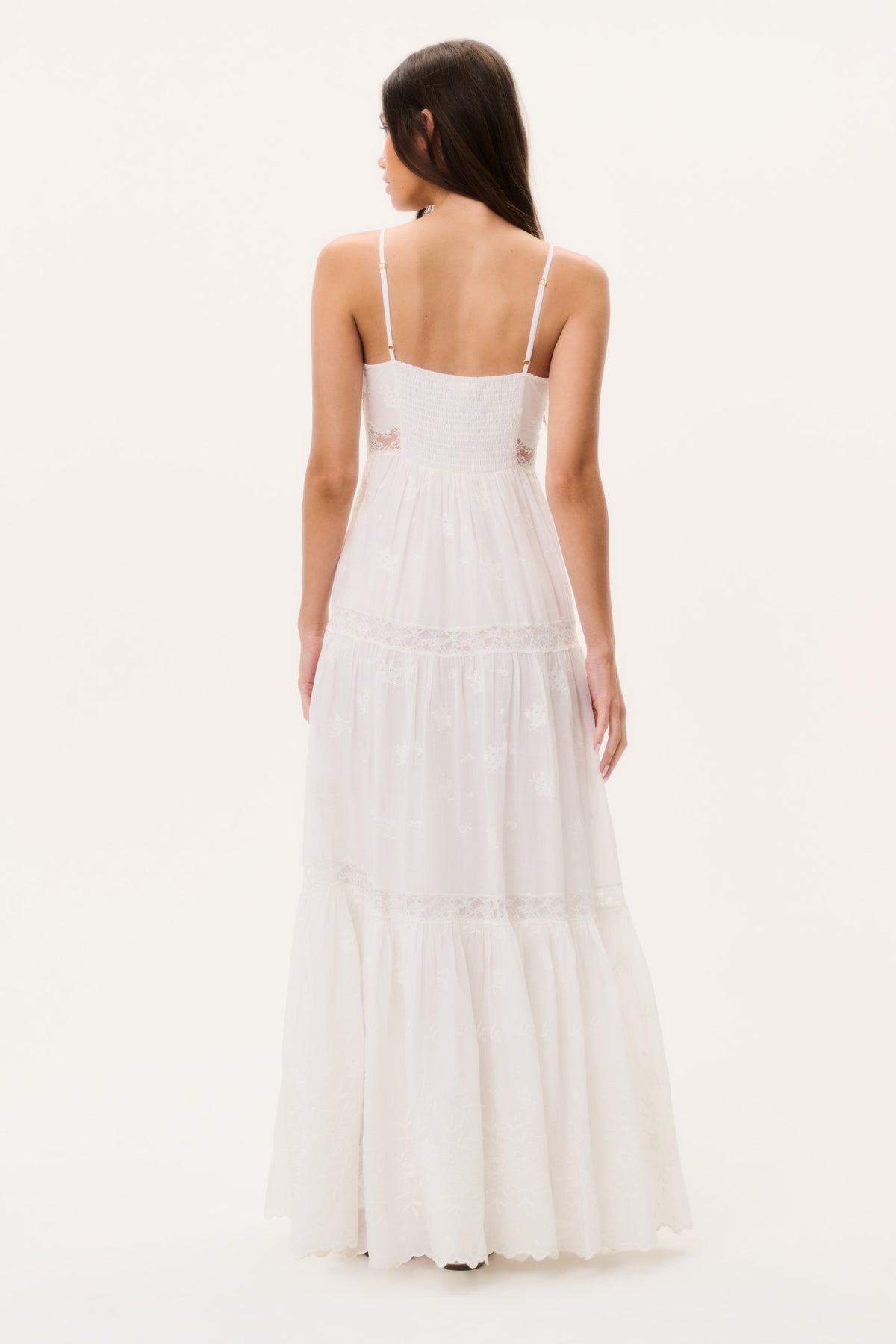 Back view of optic white lace-trim maxi dress with spaghetti straps