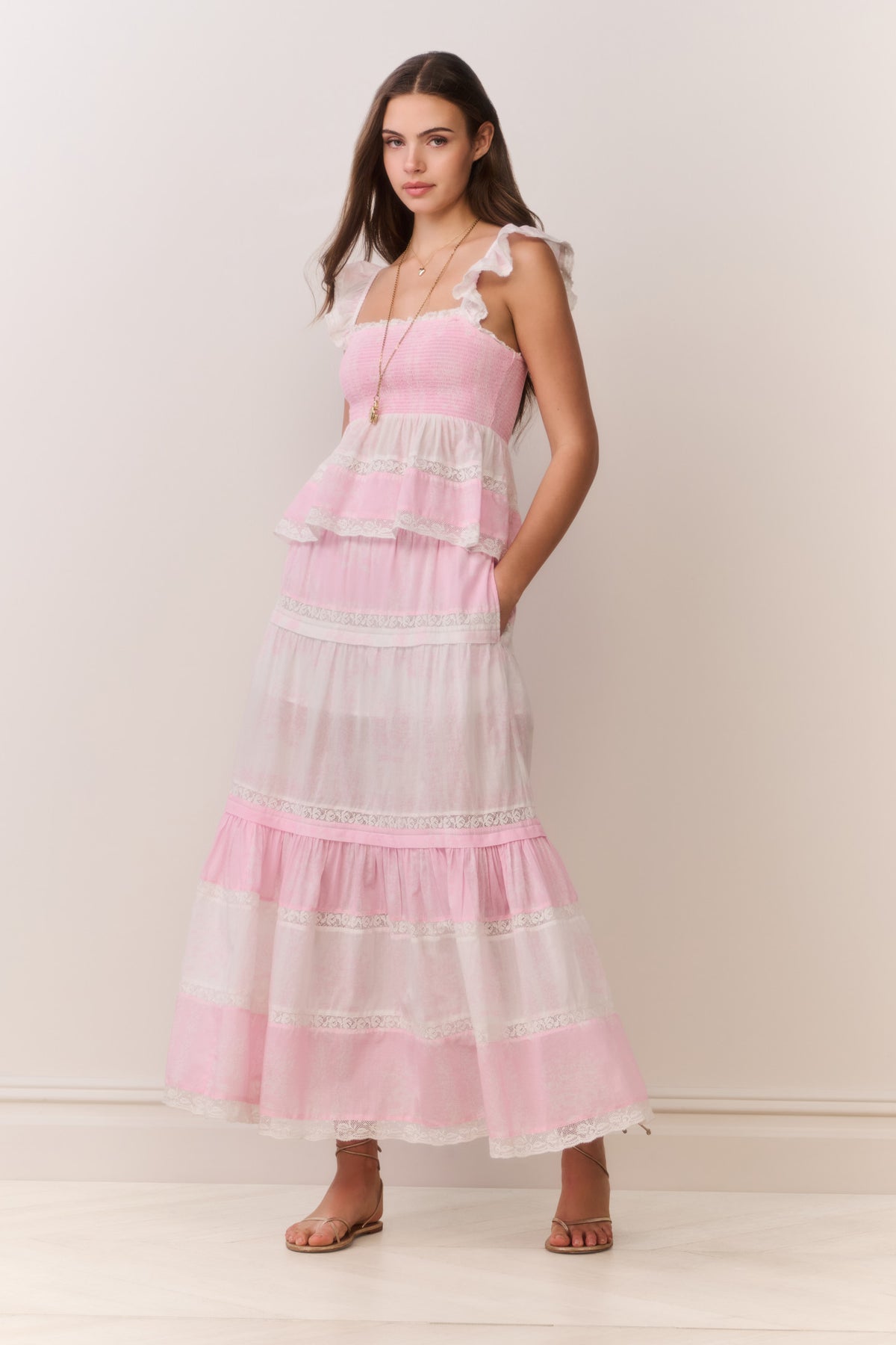Pink tiered maxi skirt with ruffled bands and mixed print