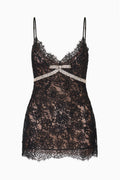 Black lace babydoll mini dress with bow at chest