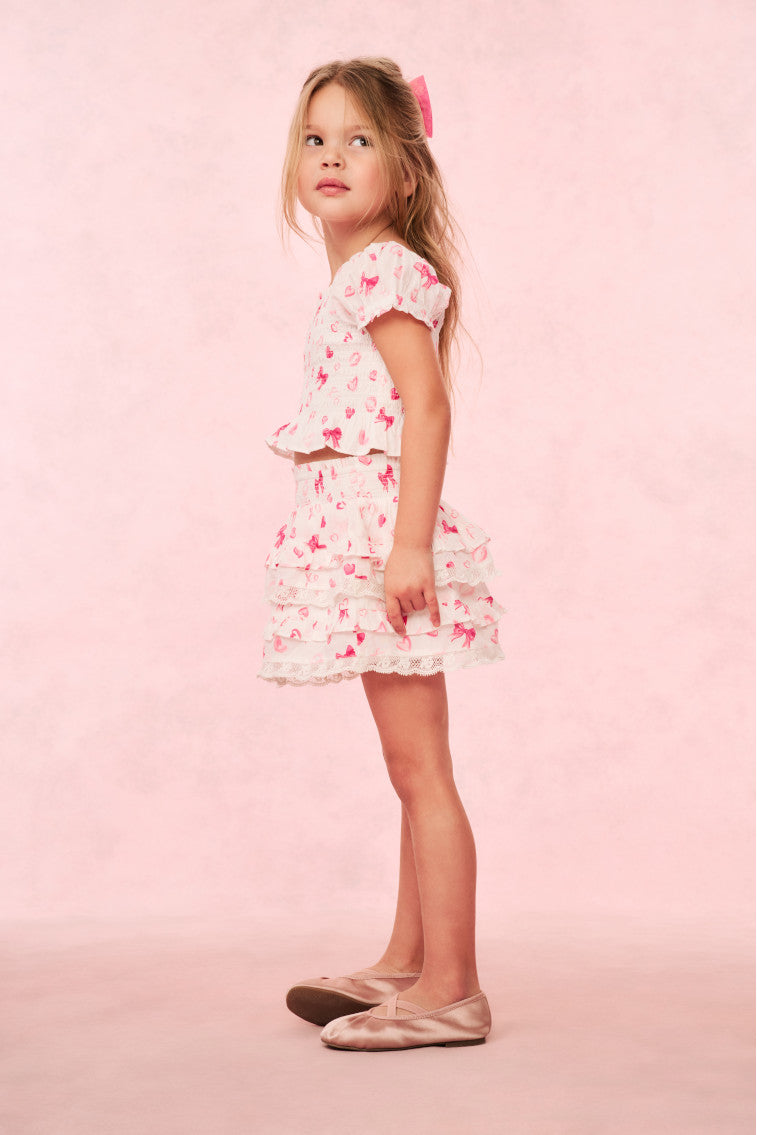 Girls pink ruffle tier skirt with heart and kiss print, knee-length