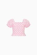 Tween pink heart-print top with short puff sleeves and ruffled hem