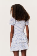Back view: light blue printed tiered ruffle mini skirt with layered hem