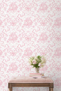 Peony pink toile floral wallpaper with repeating motif pattern on wall
