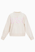 Cream crew sweatshirt with large pink floral “U S C” applique-style lettering on front