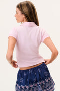 Pink polo shirt back view with short sleeves and collar