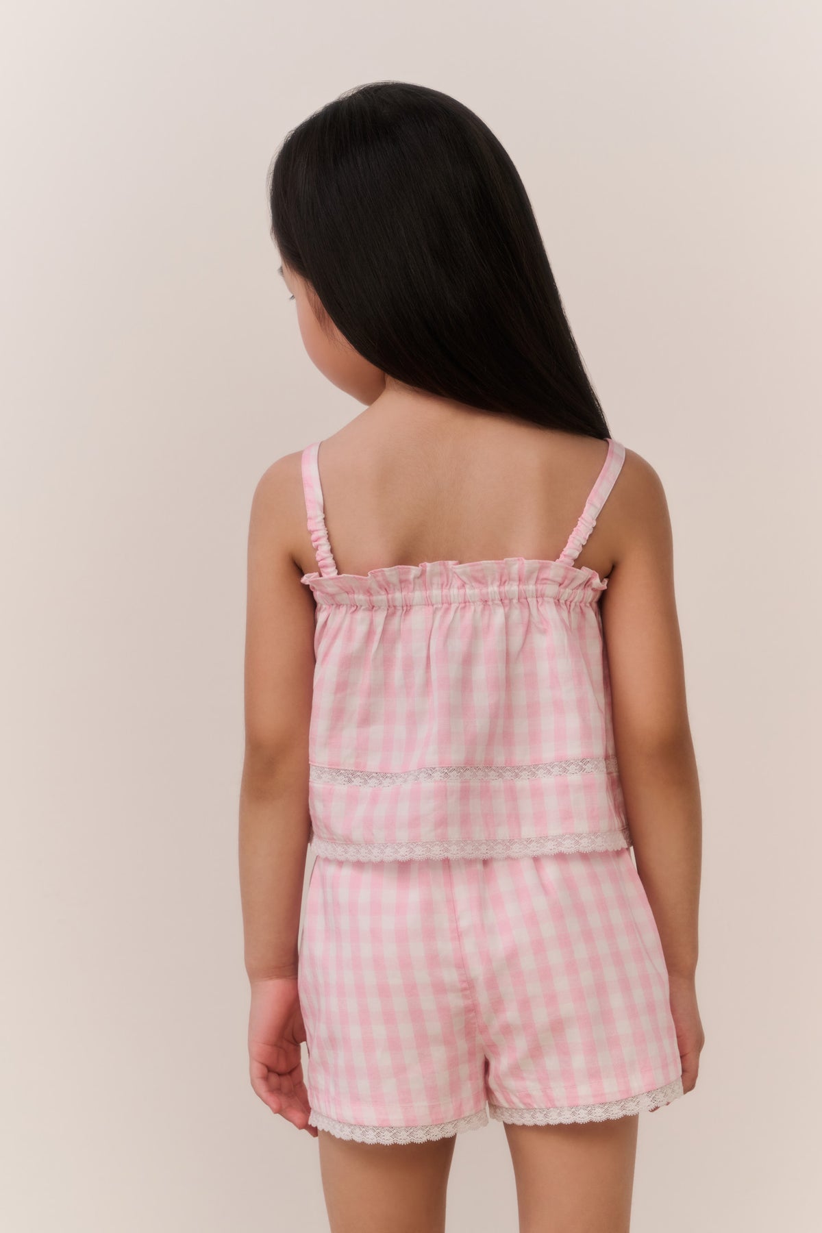 Girls' pink gingham shorts with elastic waist and ruffle-trim leg openings