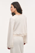 Cream crepe top, back view with scalloped lace hem and lace-trim neckline