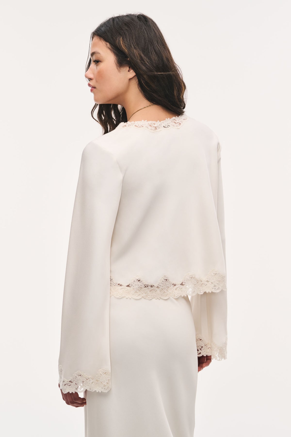 Cream crepe top, back view with scalloped lace hem and lace-trim neckline