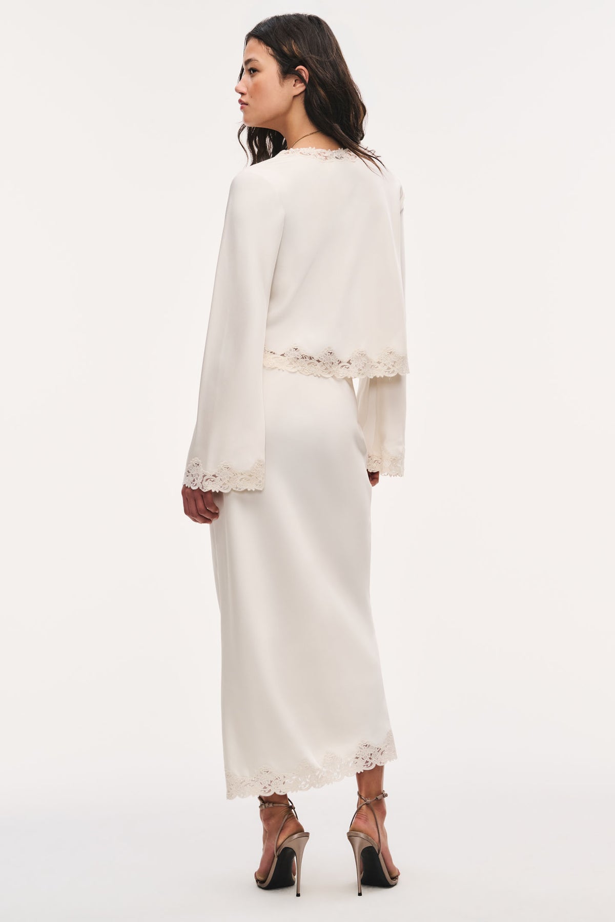 Alabaster crepe maxi skirt with lace trim along hem and side