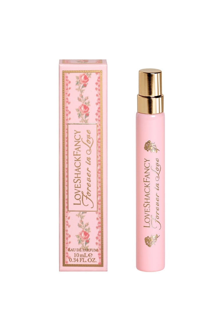 Pink eau de parfum travel spray with gold cap and matching gift box