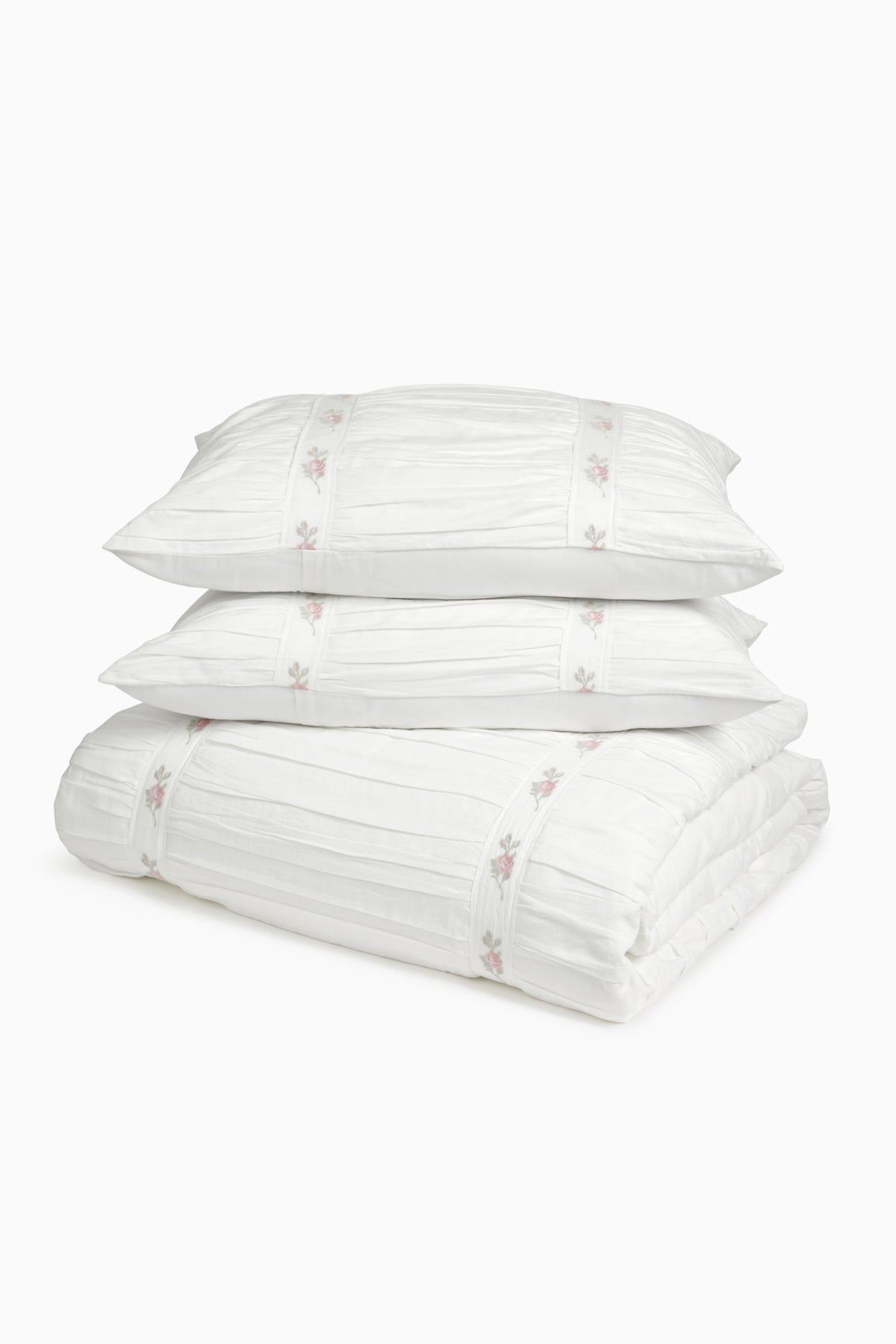 White embroidered duvet cover and matching shams set with floral details