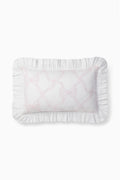 Rosewater throw pillow with ruffled edges and embroidered bow-and-vines design