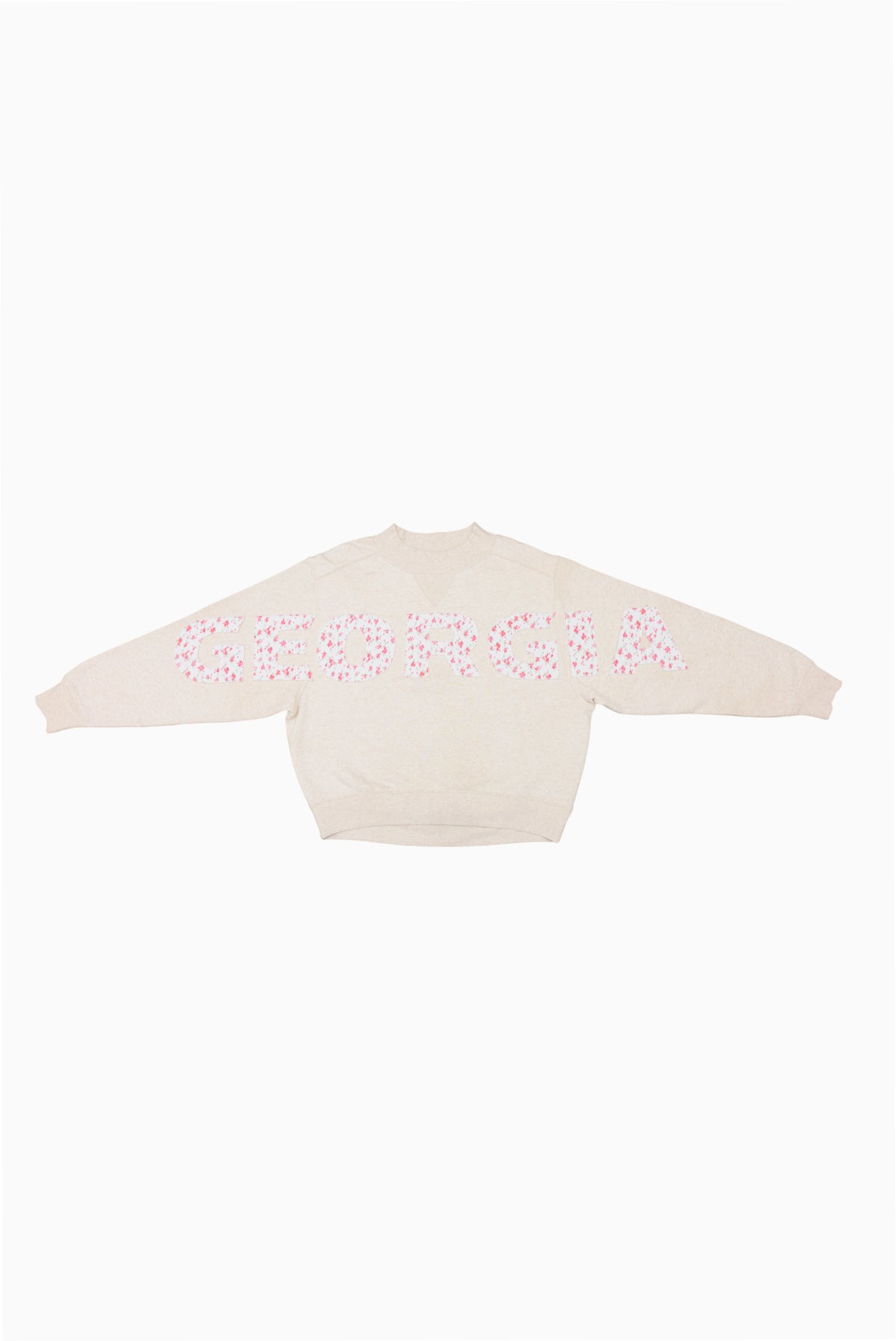 Cream mockneck crew sweatshirt with pink dotted graphic across the back
