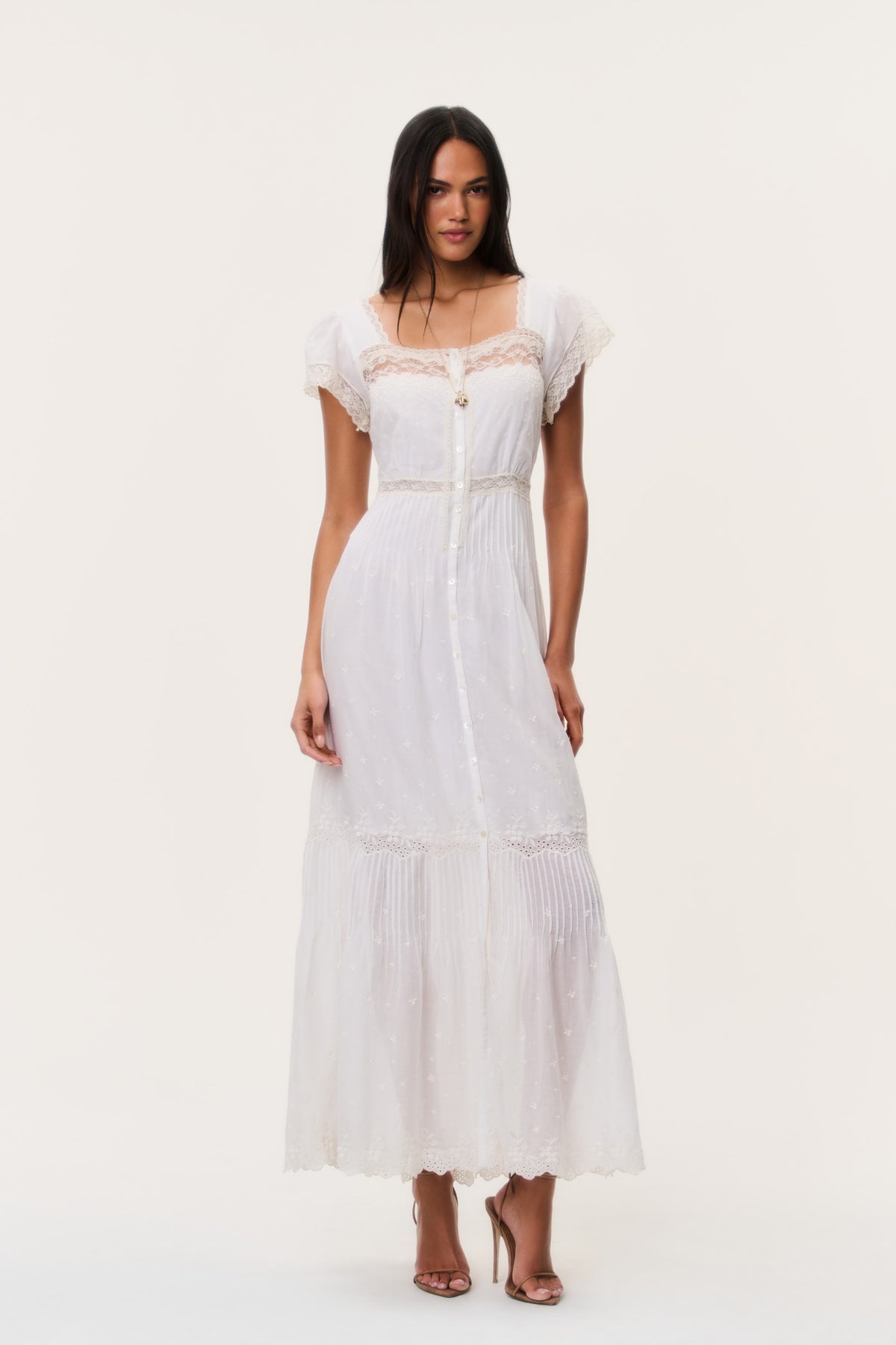 Ivory cotton lace maxi dress with cap sleeves, button-front bodice and tiered skirt