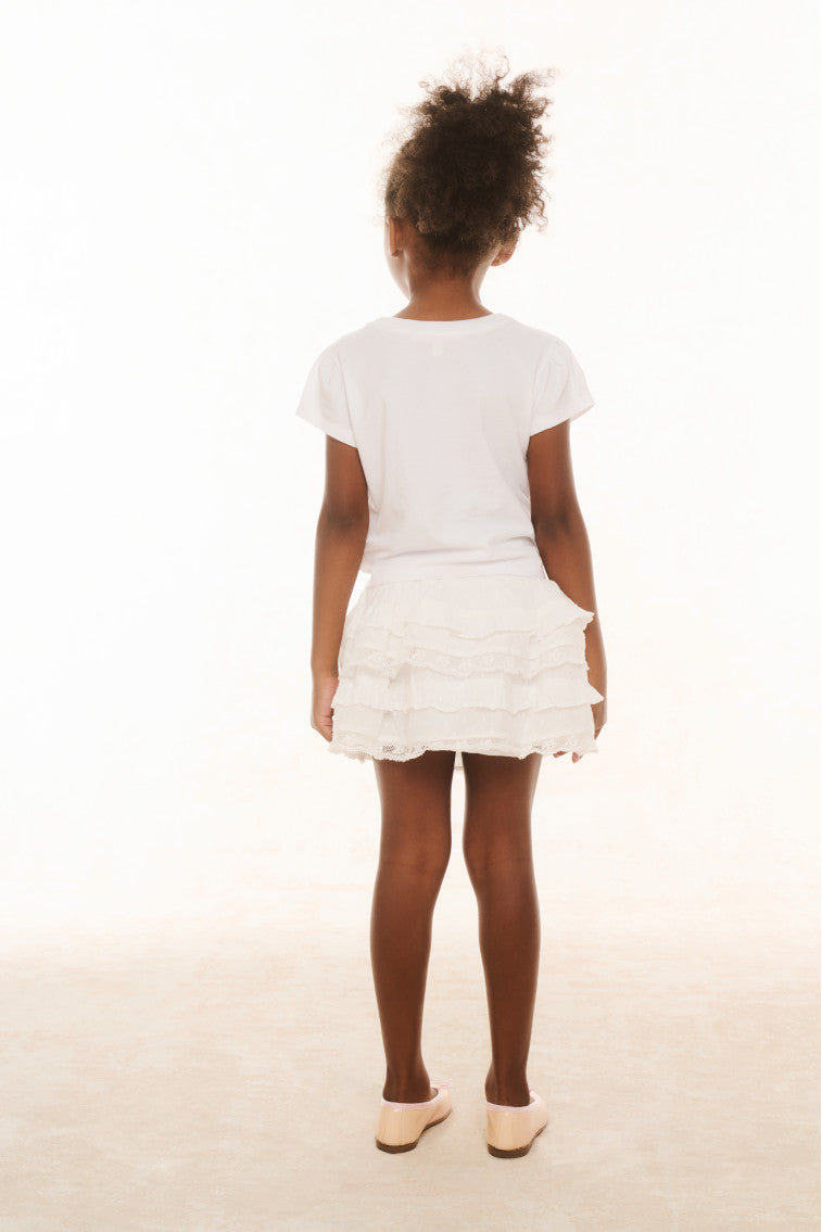 Girls white tiered ruffle skirt with elastic waistband, back view