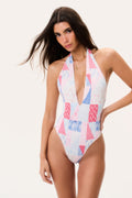 Halter one-piece swimsuit with deep V neckline, patchwork print in white, blue, and pink.