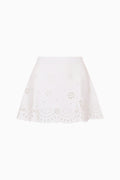 White eyelet knit mini skirt with bandana motif and scalloped hemline