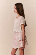 Light pink floral tiered ruffle skirt with stacked ruffles, side view
