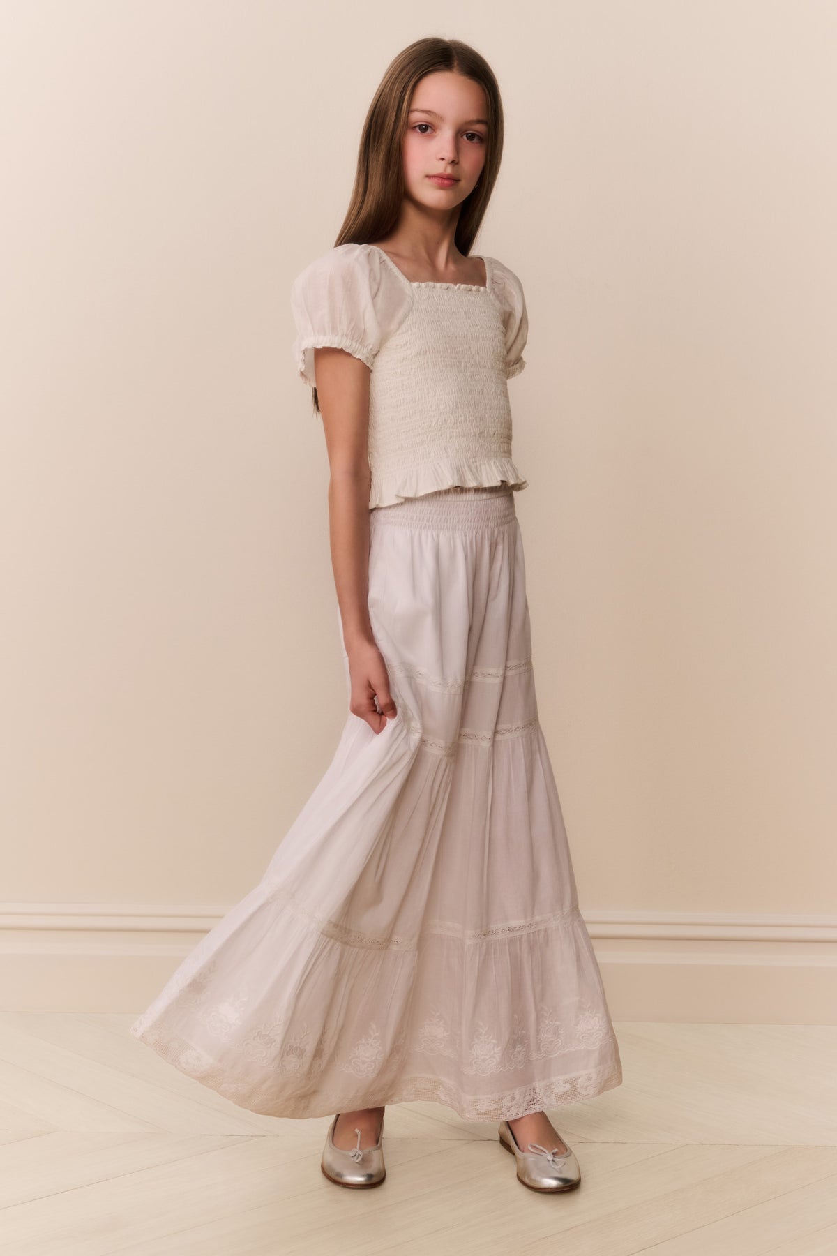 White cotton tiered maxi skirt with gathered tiers and soft woven texture